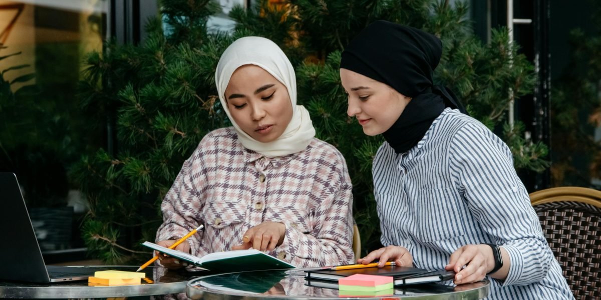Friends engage in a lively discussion about their favorite books in a relaxed setting.