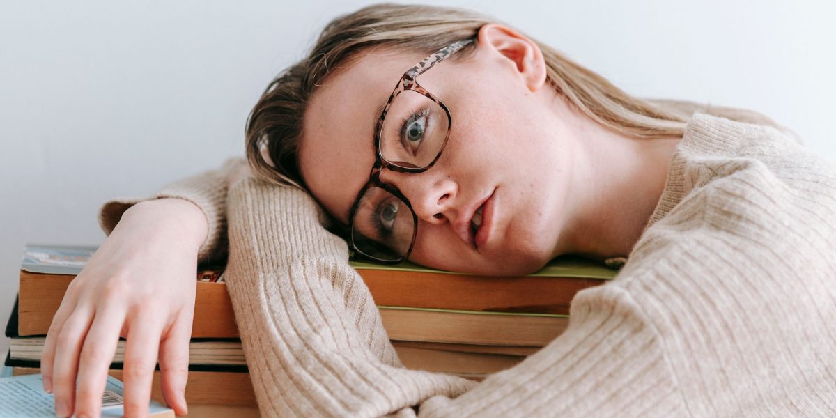 A reader contemplates a multitude of book options, reflecting the modern challenge of selection.