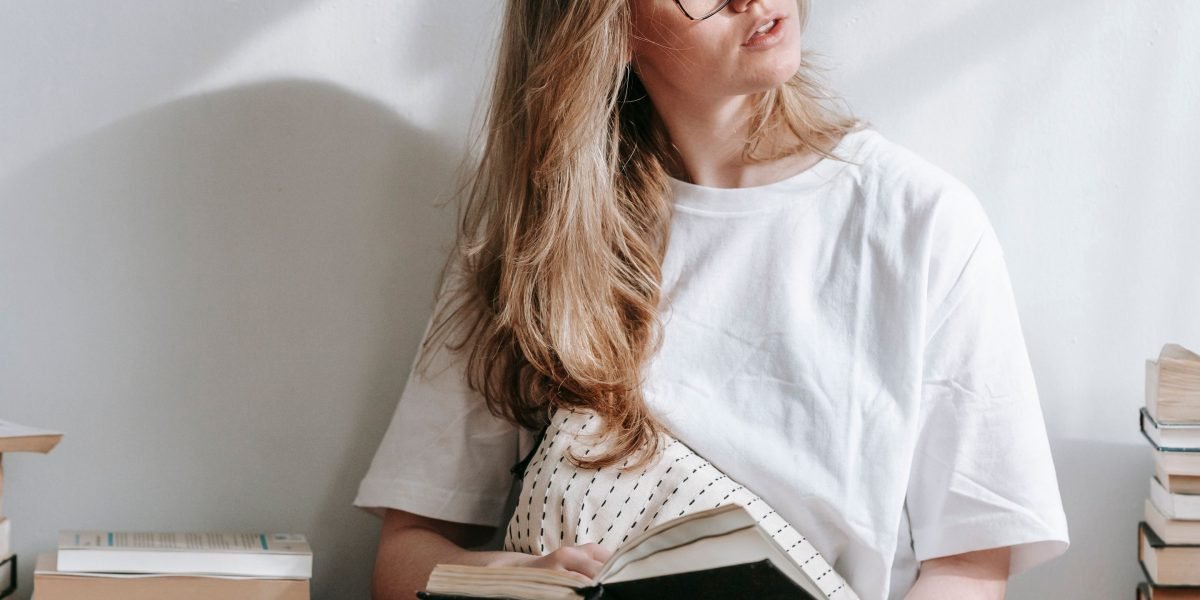 A reader reflecting on a book they just finished, contemplating the story's impact.