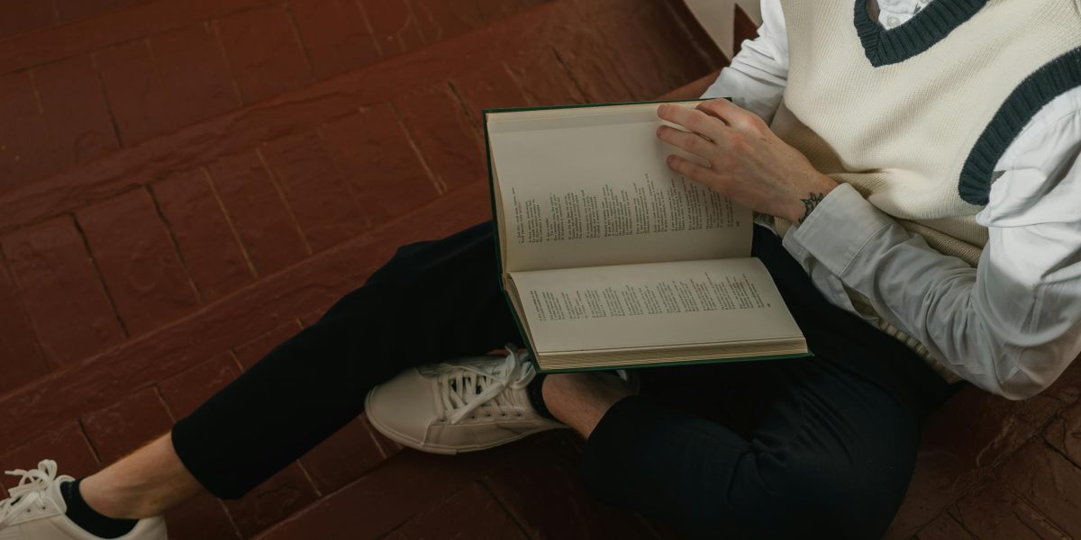A person completely absorbed in a book, demonstrating the immersive power of a compelling story.