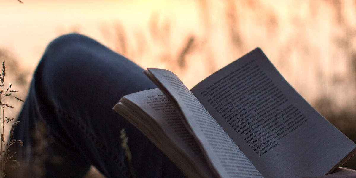 A person gently closing a book, deep in thought after an impactful reading experience.