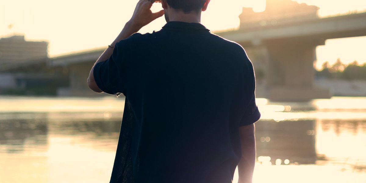 A person gazes out towards a vast horizon, reflecting on profound influence and the expanse of literary legacy.
