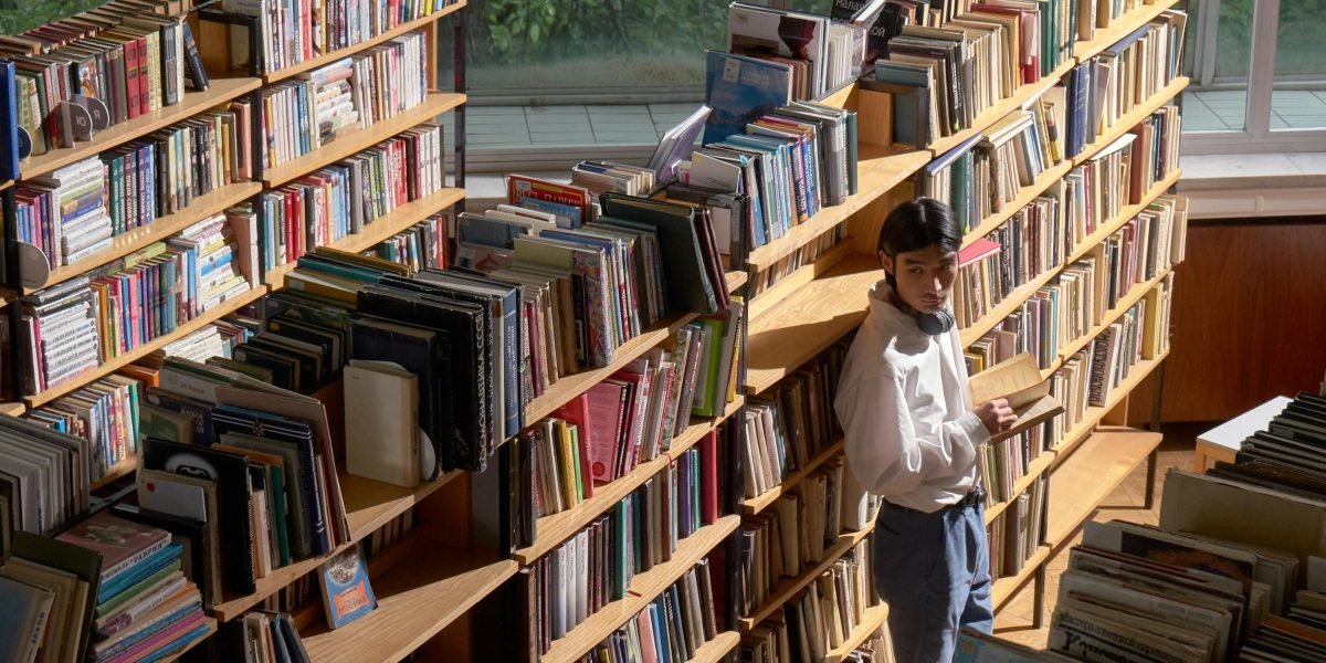 A person browsing diverse classic literature, considering different authors beyond Dickens.